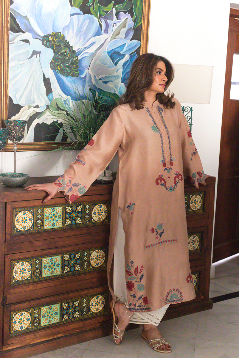 Teal, crimson, and turquoise embroidery on khadi silk kurta