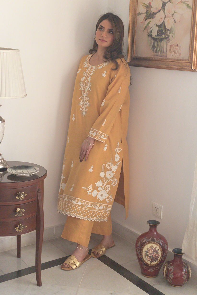 Tonal izzar pants styled with mustard embroidered kurta