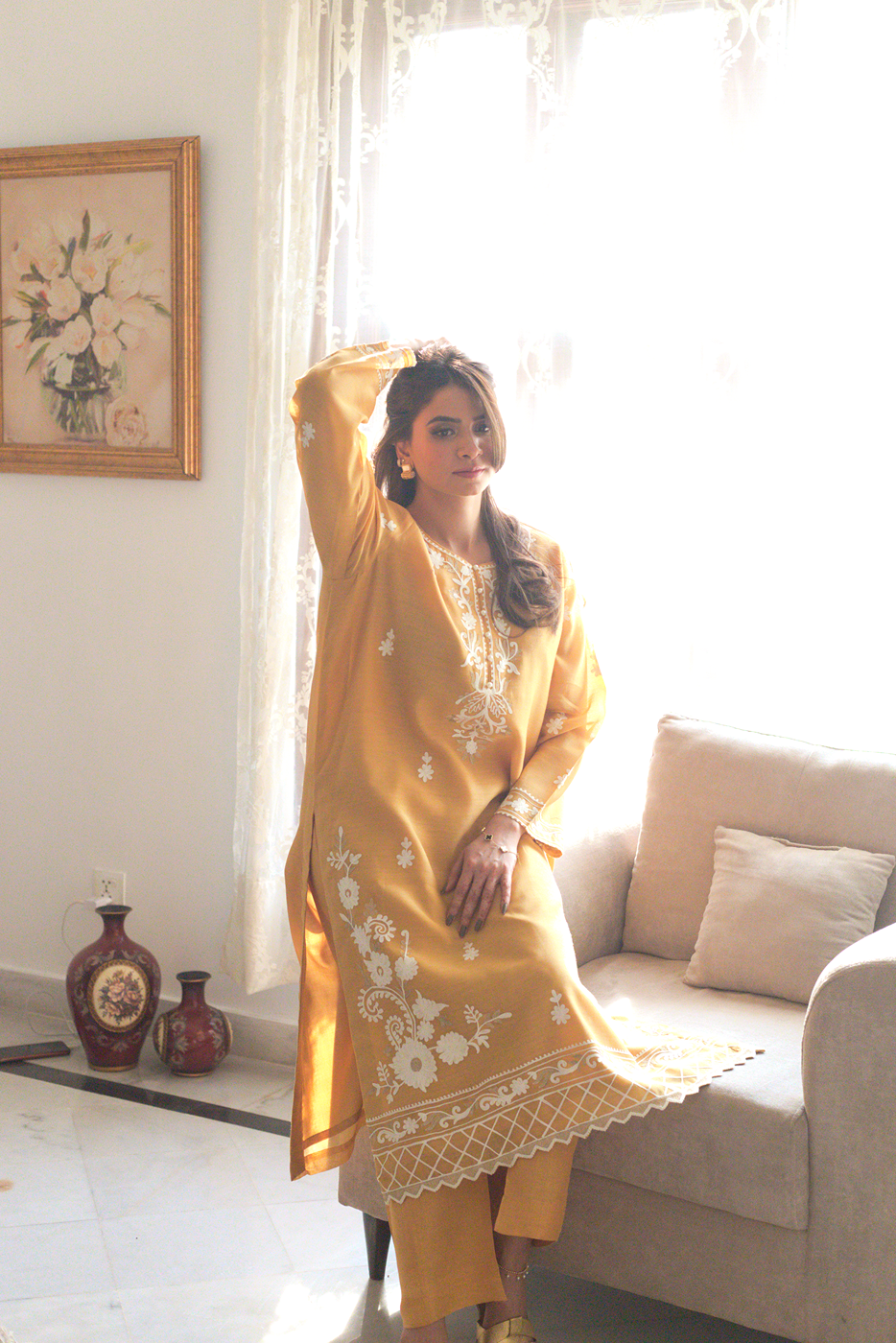 Scalloped hem of mustard semi formal outfit with embroidery