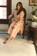 Side profile of peach embroidered semi formal dress