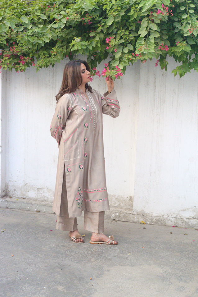 Front view of taupe embroidered semi formal outfit