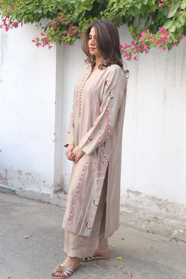Front view of taupe embroidered semi formal outfit