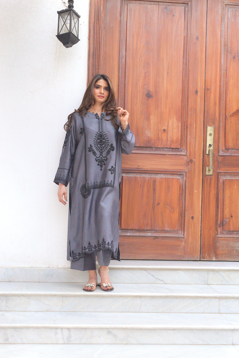 Front view of embroidered semi formal outfit