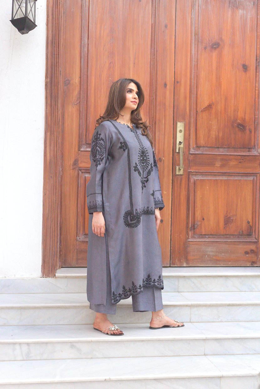 Front view of embroidered semi formal outfit