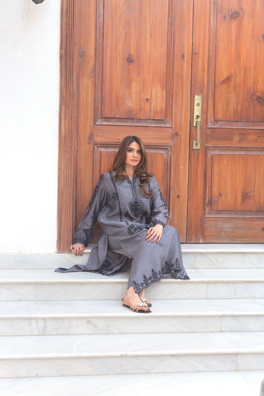 Model in grey embroidered semi formal dress