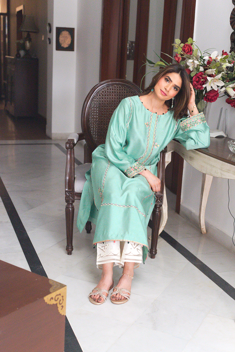 Ivory cutwork izzar pants paired with semi formal kurta