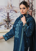 Off-white cutwork pants paired with teal semi formal ensemble