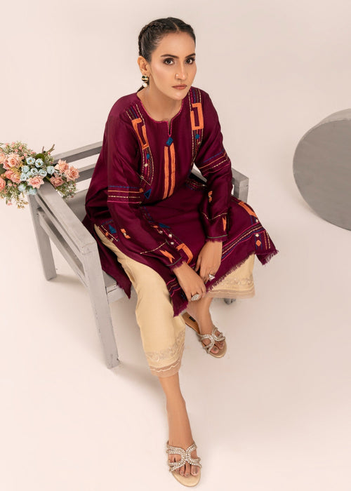 Beige cutwork izzar pants with plum shirt

