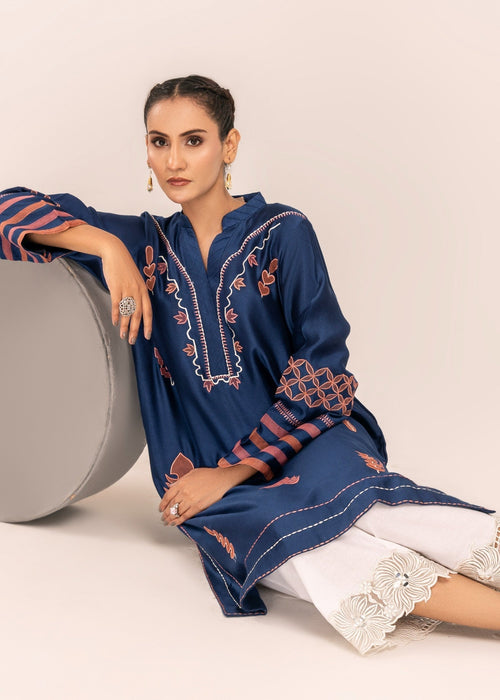 White cutwork izzar pants paired with Arzoo shirt

