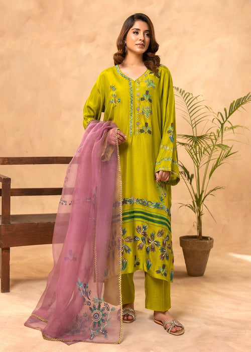 Close-up applique embroidery on green formal shirt

