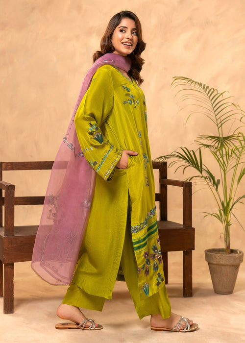 Close-up applique embroidery on green formal shirt


