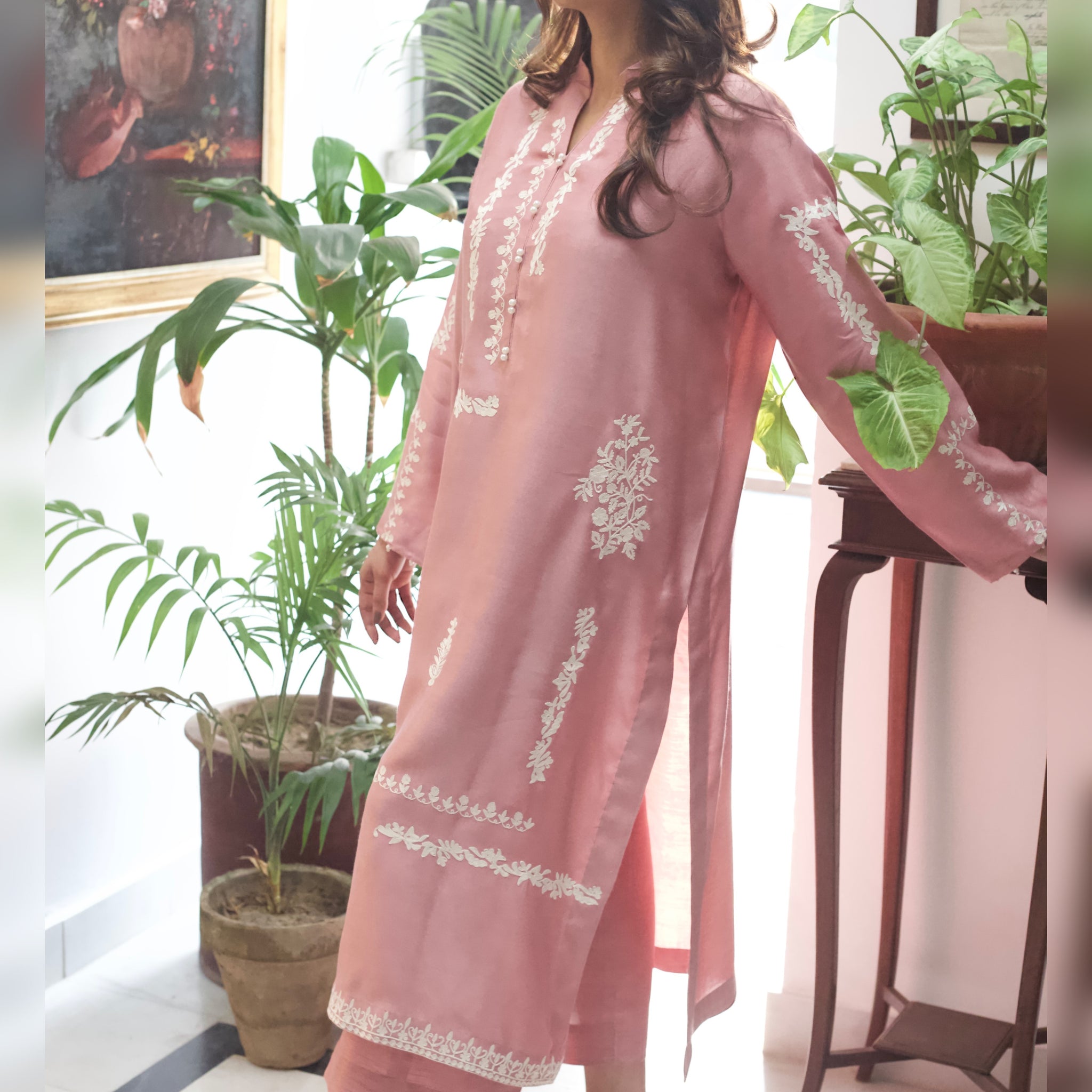 Front view of tea pink embroidered semi formal outfit