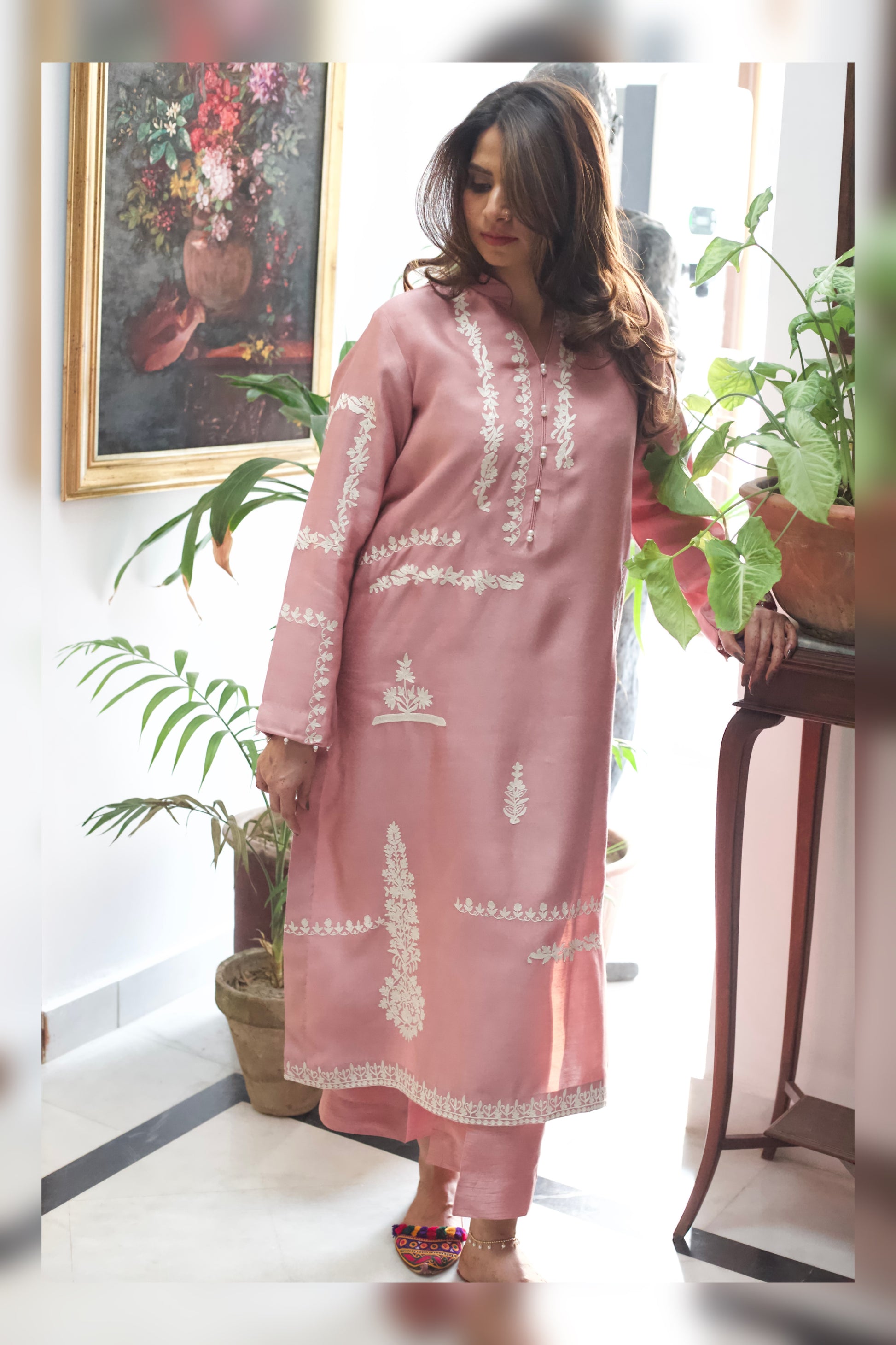 Model in Elara semi formal with izzar pants
