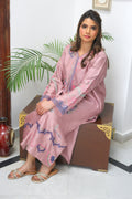 Close-up of thread embroidery and sheesha accents on kurta