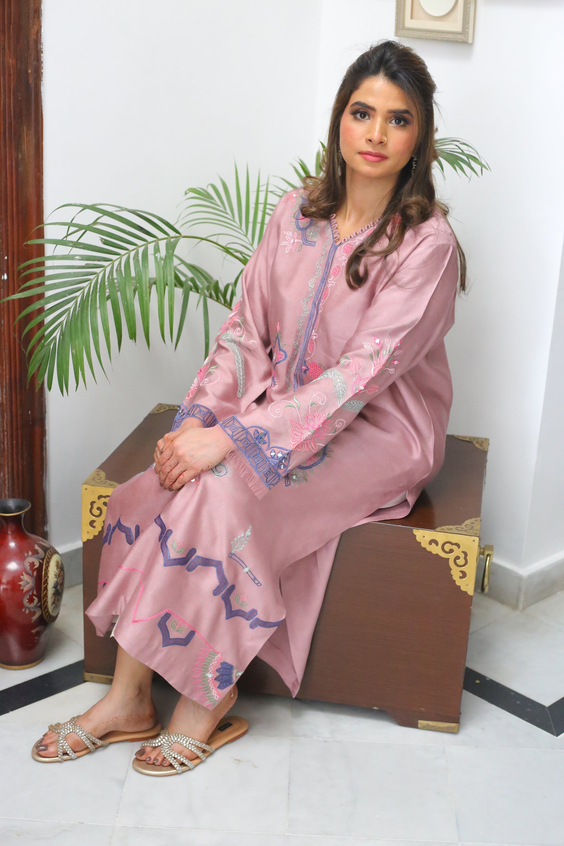 Close-up of thread embroidery and sheesha accents on kurta